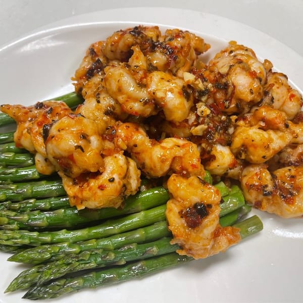 Mainland China Bistro's spicy shrimp with black bean sauce, served over a bed of green asparagus.