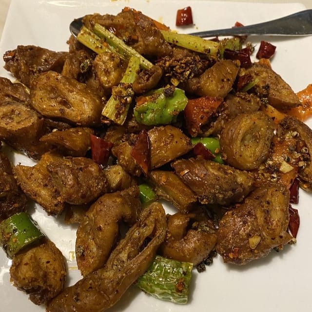 干煸肥肠 Dry Sauteed Pork Intestine with Dried Red Chili Peppers.